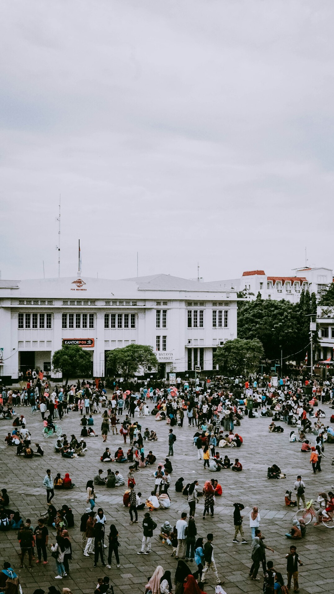 crowd gathering in city square