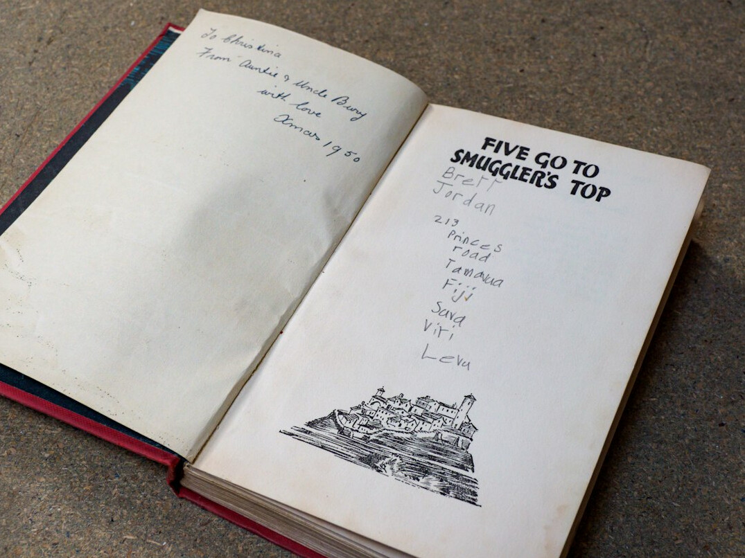 Open notebook filled with handwritten research annotations and diagrams