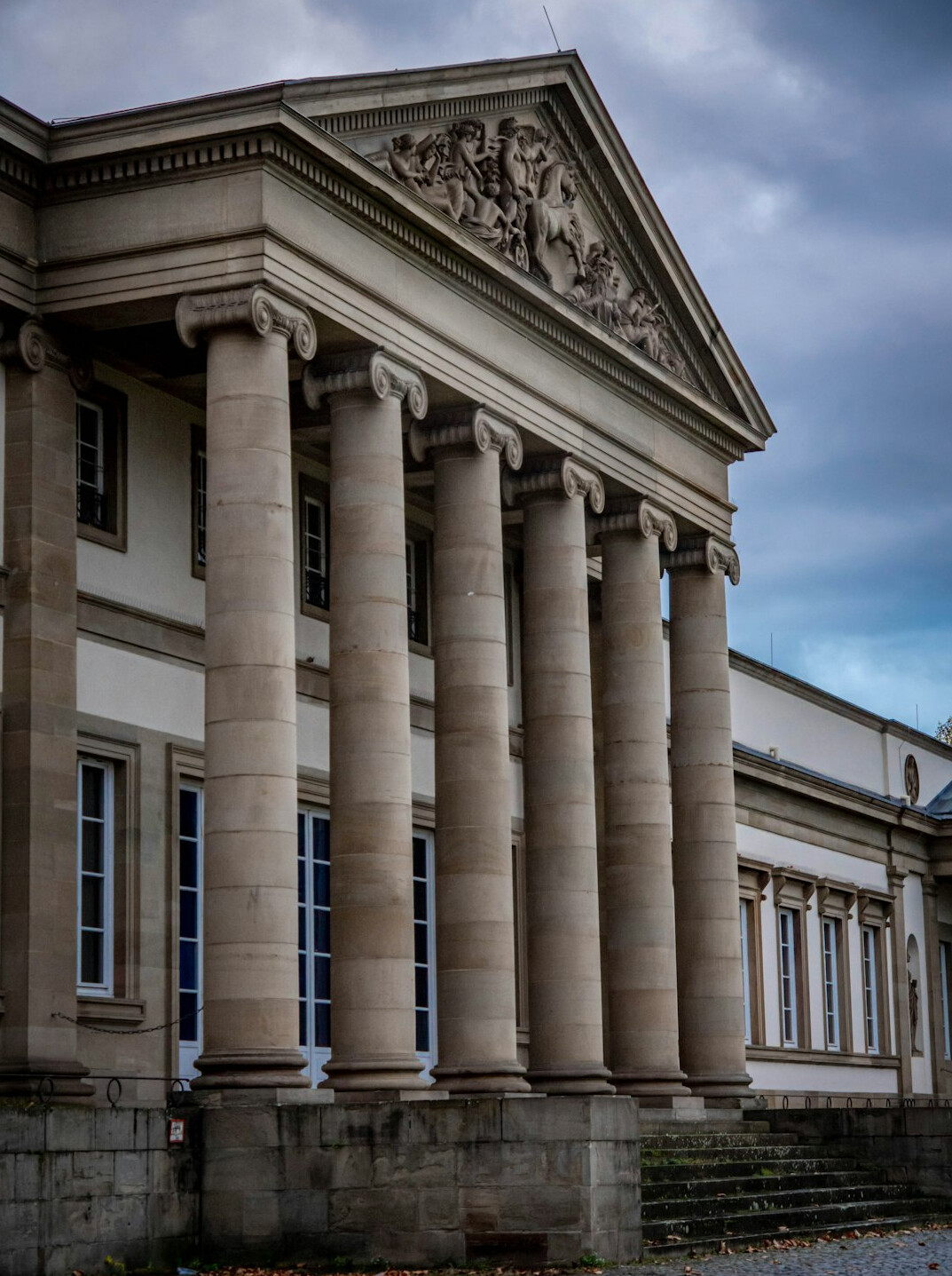 Exterior facade of a classical museum building with large stone columns